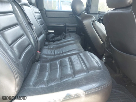 2005 Hummer H2 SUV with VIN 5GRGN23U25H128791, listed as a IAAI auction lot 42115436 with 286,818 mi miles. Bid and sale history available at carsss.com. Image 8.