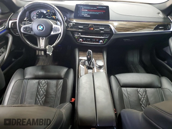 2018 BMW 5 Series M550i xDrive with VIN WBAJB9C55JB050213, listed as a Copart auction lot 61714255 with 34,700 mi miles and Salvage title. Bid and sale history available at DreamBid. Image 8.