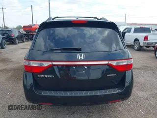2013 Honda Odyssey Touring with VIN 5FNRL5H95DB086041, listed as a IAAI auction lot 42477974 with 213,343 mi miles and . Bid and sale history available at DreamBid. Image 16.
