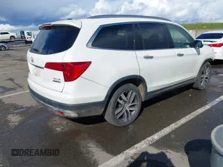 2017 Honda Pilot Elite with VIN 5FNYF6H06HB041609, listed as a IAAI auction lot 41804477 with 134,535 mi miles and . Bid and sale history available at DreamBid. Image 4.