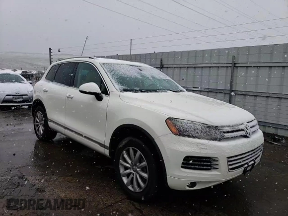 2011 Volkswagen Touareg Sport with VIN WVGFF9BP8BD002982, listed as a Copart auction lot 53958555 with 156,742 mi miles and Salvage Title. Bid and sale history available at DreamBid. Image 14.