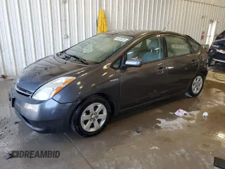 2007 Toyota Prius z VIN JTDKB20U873256476, wystawiony jako Copart lot #64435235 z przebiegiem 188 686 mil mil oraz Nie do naprawy • Non repairable. Historia ofert i sprzedaży dostępna na DreamBid. Obrazek 1.