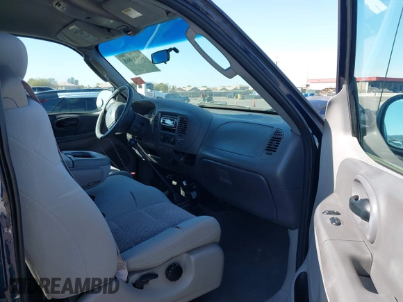 2003 Ford F-150 XL with VIN 1FTRX18WX3NA22323, listed as a IAAI auction lot 41635869 with 129,029 mi miles. Bid and sale history available at carsss.com. Image 5.