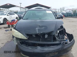 2004 Toyota Camry LE with VIN 4T1BF30K34U080477, listed as a IAAI auction lot 41956998 with 135,441 mi miles. Bid and sale history available at carsss.com. Image 12.