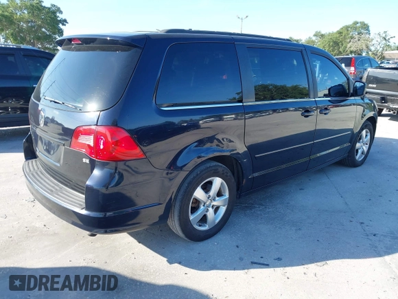 2011 Volkswagen Routan SE with VIN 2V4RW3DG5BR668194, listed as a IAAI auction lot 42483379 with 203,945 mi miles and . Bid and sale history available at DreamBid. Image 4.