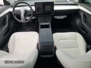 2023 Tesla Model 3 with VIN 5YJ3E1EA8PF499535, listed as a Copart auction lot 59974115 with 18,365 mi miles and Salvage title. Bid and sale history available at DreamBid. Image 8.