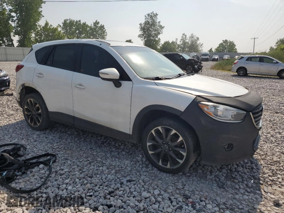 2016 Mazda CX-5 Grand Touring z VIN JM3KE4DY7G0864109, wystawiony jako Copart lot #59635865 z przebiegiem Nie podano mil oraz Czysty tytuł • Clean title. Historia ofert i sprzedaży dostępna na DreamBid. Obrazek 4.
