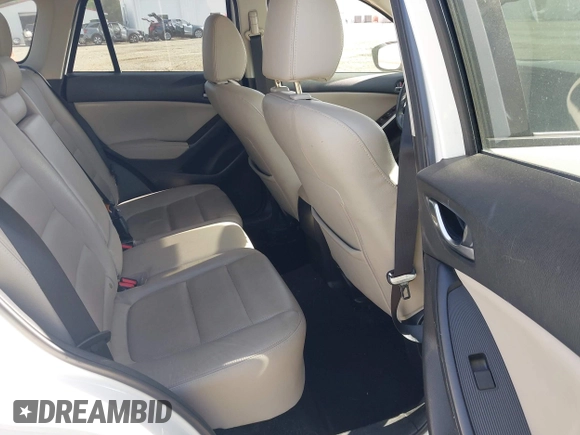 2015 Mazda CX-5 Grand Touring with VIN JM3KE2DY5F0498718, listed as a IAAI auction lot 42070000 with 129,327 mi miles. Bid and sale history available at carsss.com. Image 8.