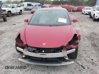 2018 Tesla Model 3 Long Range Battery with VIN 5YJ3E1EB7JF055384, listed as a IAAI auction lot 41924325 with 52,039 mi miles and . Bid and sale history available at DreamBid. Image 11.