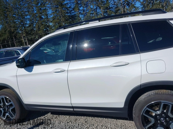 2023 Honda Passport Elite with VIN 5FNYF8H01PB004087, listed as a IAAI auction lot 42045433 with 20,677 mi miles and . Bid and sale history available at DreamBid. Image 14.