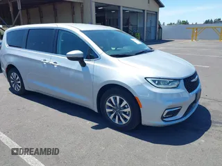2023 Chrysler Pacifica Hybrid Touring L with VIN 2C4RC1L75PR614460, listed as a IAAI auction lot 42628545 with 68,668 mi miles and . Bid and sale history available at DreamBid. Image 1.