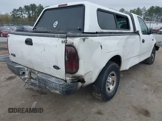 2003 Ford F-150 XL with VIN 1FTRF17243NB84790, listed as a IAAI auction lot 41955730 with Not provided miles and . Bid and sale history available at DreamBid. Image 4.