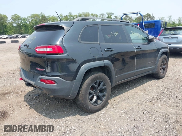 2014 Jeep Cherokee Trailhawk with VIN 1C4PJMBS8EW285276, listed as a IAAI auction lot 42408796 with Not provided miles and . Bid and sale history available at DreamBid. Image 4.