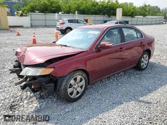 2009 Kia Optima LX z VIN KNAGE228795334599, wystawiony jako Copart lot #59276515 z przebiegiem 180 399 mil mil oraz Szkoda całkowita • Salvage title. Historia ofert i sprzedaży dostępna na DreamBid. Obrazek 1.