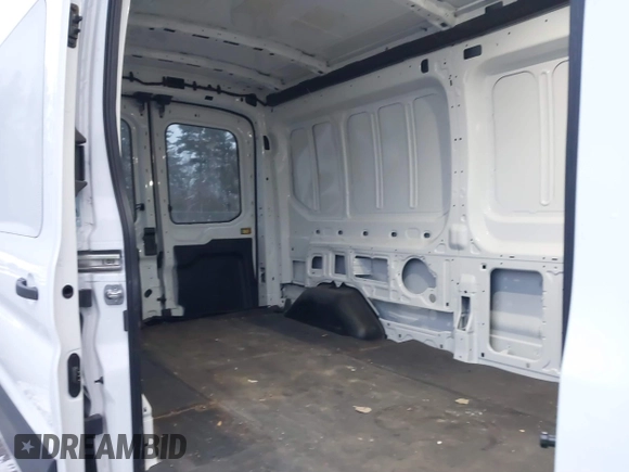 2023 Ford Transit Cargo with VIN 1FTBR1C84PKB27872, listed as a IAAI auction lot 41025498 with 6,710 mi miles and . Bid and sale history available at DreamBid. Image 7.