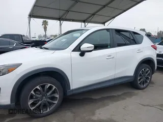 2016 Mazda CX-5 Grand Touring with VIN JM3KE4DY7G0737232, listed as a IAAI auction lot 42158279 with Not Provided miles and . Bid and sale history available at DreamBid. Image 14.