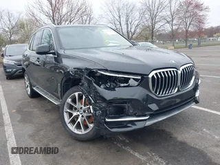 2023 BMW X5 xDrive40i with VIN 5UXCR6C0XP9P90557, listed as a IAAI auction lot 41860825 with 49,737 mi miles. Bid and sale history available at carsss.com. Image 1.