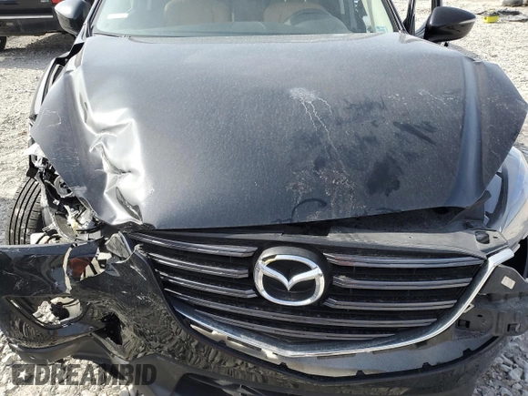 2016 Mazda CX-5 Touring z VIN JM3KE4CY0G0667171, wystawiony jako Copart lot #51579005 z przebiegiem 39 487 mil mil oraz Szkoda całkowita • Salvage title. Historia ofert i sprzedaży dostępna na DreamBid. Obrazek 13.