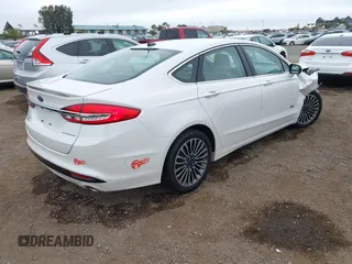 2017 Ford Fusion Titanium with VIN 3FA6P0SU2HR379834, listed as a IAAI auction lot 42440382 with 55,646 mi miles and . Bid and sale history available at DreamBid. Image 4.