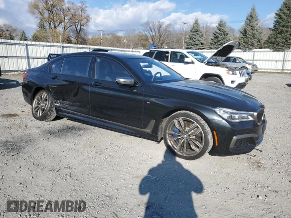 2019 BMW 7 Series M760i xDrive with VIN WBA7H6C55KG615037, listed as a Copart auction lot 80218404 with 43,405 mi miles and Salvage Title. Bid and sale history available at carsss.com. Image 4.