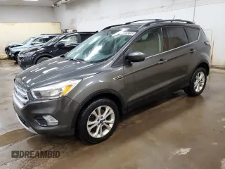 2018 Ford Escape SE z VIN 1FMCU9GD3JUA90992, wystawiony jako Copart lot #57409845 z przebiegiem 112 658 mil mil oraz Czysty tytuł • Clean title. Historia ofert i sprzedaży dostępna na DreamBid. Obrazek 1.