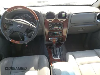 2006 GMC Envoy Denali with VIN 1GKET63M762190296, listed as a Copart auction lot 46691595 with 128,985 mi miles and Salvage Title. Bid and sale history available at carsss.com. Image 8.
