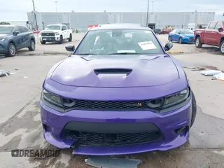 2023 Dodge Charger Scat Pack Widebody with VIN 2C3CDXGJ5PH699595, listed as a IAAI auction lot 41303894 with 1,828 mi miles and . Bid and sale history available at DreamBid. Image 13.