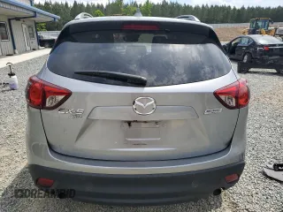 2014 Mazda CX-5 Grand Touring with VIN JM3KE4DY9E0416967, listed as a Copart auction lot 54215285 with 77,296 mi miles and Salvage Title. Bid and sale history available at DreamBid. Image 6.