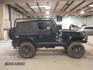 1999 Jeep Wrangler Sahara z VIN 1J4FY49S4XP432567, wystawiony jako IAAI lot #41562455 z przebiegiem Nie podano mil oraz . Historia ofert i sprzedaży dostępna na DreamBid. Obrazek 13.