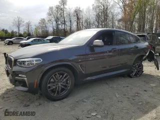 2019 BMW X4 M40i with VIN 5UXUJ5C5XKLJ64004, listed as a Copart auction lot 52106895 with 74,599 mi miles and Salvage Title. Bid and sale history available at carsss.com. Image 1.