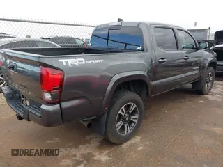 2018 Toyota Tacoma SR5 with VIN 3TMAZ5CN0JM061233, listed as a IAAI auction lot 41944668 with 94,314 mi miles and . Bid and sale history available at DreamBid. Image 4.