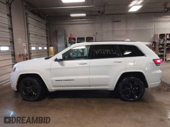 2015 Jeep Grand Cherokee Laredo with VIN 1C4RJFAG4FC660665, listed as a IAAI auction lot 41529532 with 124,099 mi miles. Bid and sale history available at carsss.com. Image 14.