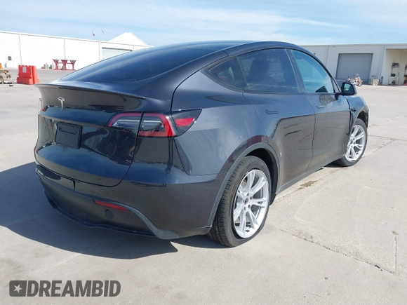 2024 Tesla Model Y with VIN 7SAYGDED9RF044789, listed as a IAAI auction lot 41817318 with Not Provided miles and . Bid and sale history available at DreamBid. Image 4.
