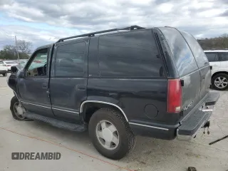 1999 GMC Yukon with VIN 1GKEK13R9XJ803351, listed as a Copart auction lot 81800974 with 0 mi miles and Salvage Title. Bid and sale history available at carsss.com. Image 2.