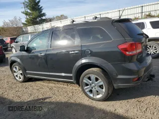 2013 Dodge Journey R/T with VIN 3C4PDDFG6DT736495, listed as a Copart auction lot 76912344 with 186,004 mi miles and Clean title. Bid and sale history available at DreamBid. Image 2.
