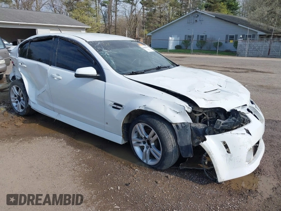 2009 Pontiac G8 with VIN 6G2ER57729L153123, listed as a IAAI auction lot 42046031 with 100,419 mi miles. Bid and sale history available at carsss.com. Image 1.