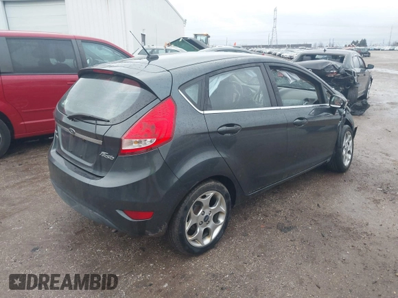 2011 Ford Fiesta SES with VIN 3FADP4FJ7BM111381, listed as a IAAI auction lot 41226251 with 93,694 mi miles. Bid and sale history available at carsss.com. Image 4.