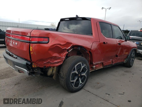 2023 Rivian R1T Adventure with VIN 7FCTGAAA2PN026211, listed as a Copart auction lot 77705414 with Not Provided miles and Salvage Title. Bid and sale history available at DreamBid. Image 3.