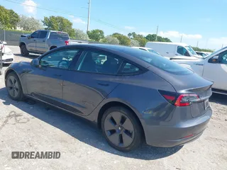 2023 Tesla Model 3 with VIN 5YJ3E1EA8PF626235, listed as a IAAI auction lot 42022893 with 30,333 mi miles and . Bid and sale history available at DreamBid. Image 3.