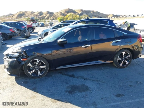 2016 Honda Civic Sedan Touring with VIN 19XFC1F99GE206092, listed as a IAAI auction lot 41031121 with 133,682 mi miles. Bid and sale history available at carsss.com. Image 14.