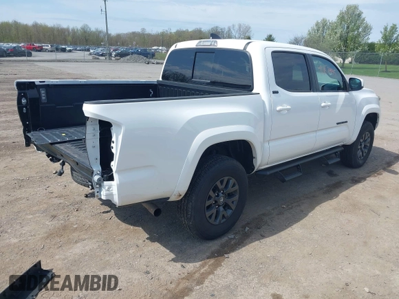 2023 Toyota Tacoma SR with VIN 3TMCZ5AN2PM642205, listed as a IAAI auction lot 42167945 with 10,595 mi miles and . Bid and sale history available at DreamBid. Image 4.