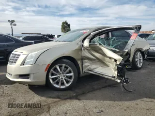 2014 Cadillac XTS Luxury with VIN 2G61M5S31E9314477, listed as a Copart auction lot 43562705 with 136,469 mi miles and Salvage Title. Bid and sale history available at DreamBid. Image 1.