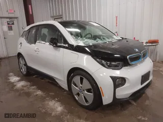 2015 BMW i3 with VIN WBY1Z4C53FV504836, listed as a IAAI auction lot 41155614 with 66,910 mi miles. Bid and sale history available at carsss.com. Image 1.
