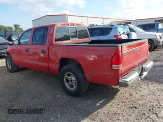 2000 Dodge Dakota Sport with VIN 1B7GL2AN0YS705134, listed as a IAAI auction lot 41997957 with 219,659 mi miles. Bid and sale history available at carsss.com. Image 3.