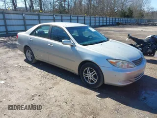 2002 Toyota Camry LE z VIN 4T1BE32K52U506649, wystawiony jako IAAI lot #41586416 z przebiegiem 312 245 mil mil oraz . Historia ofert i sprzedaży dostępna na DreamBid. Obrazek 1.