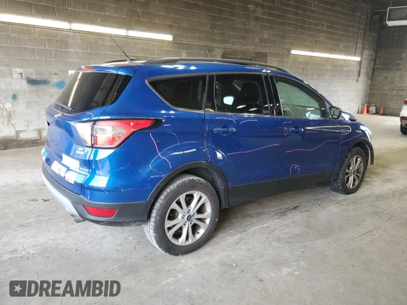 2017 Ford Escape SE z VIN 1FMCU9GD4HUD17066, wystawiony jako Copart lot #60504105 z przebiegiem 64 570 mil mil oraz Szkoda całkowita • Salvage title. Historia ofert i sprzedaży dostępna na DreamBid. Obrazek 3.