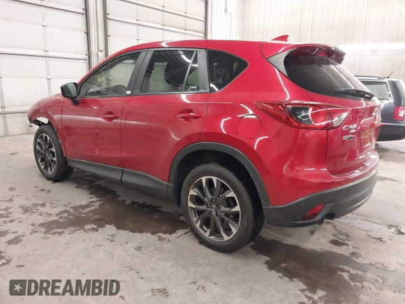 2016 Mazda CX-5 Grand Touring with VIN JM3KE4DY7G0731057, listed as a IAAI auction lot 41118072 with 134,107 mi miles and . Bid and sale history available at carsss.com. Image 3.