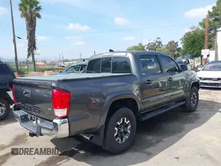 2017 Toyota Tacoma SR5 with VIN 3TMAZ5CN6HM050456, listed as a IAAI auction lot 38968606 with 48,576 mi miles and . Bid and sale history available at DreamBid. Image 4.