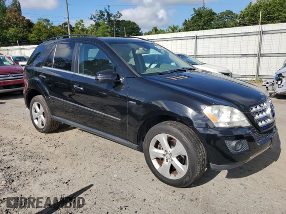 2011 Mercedes-Benz M 350 with VIN 4JGBB2FB5BA744077, listed as a Copart auction lot 61565615 with 125,813 mi miles and Salvage title. Bid and sale history available at DreamBid. Image 4.