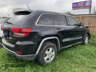 2012 Jeep Grand Cherokee Laredo with VIN 1C4RJEAG8CC119401, listed as a IAAI auction lot 41724335 with 233,265 mi miles. Bid and sale history available at carsss.com. Image 4.